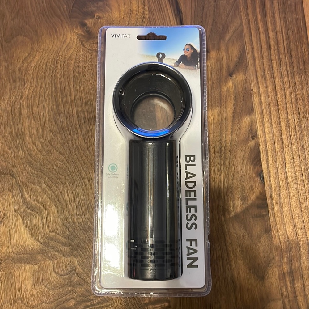 Hand held bladeless fan